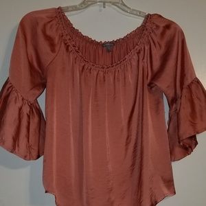 Silky coral color off the shoulder top